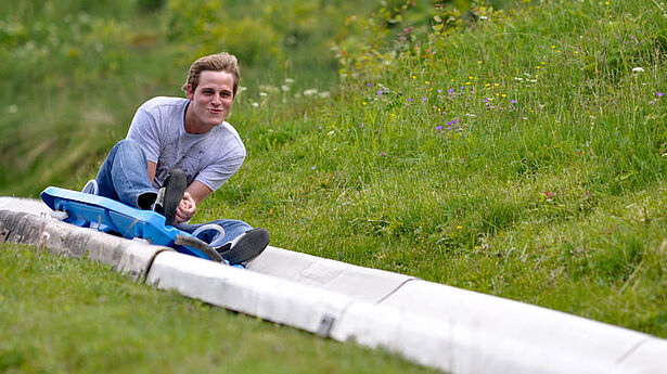 Sommer Rodelbahn Salzburger Land Junge