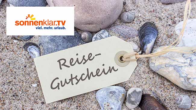 Sonnenklar.TV, Reisegutschein am Strand mit Muscheln