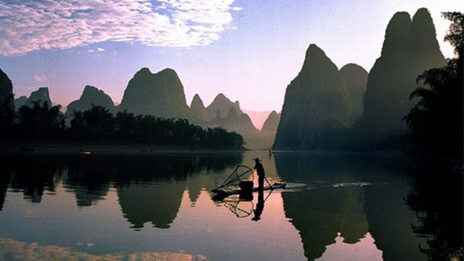China - Guilin Li Fluss, Mann auf Boot